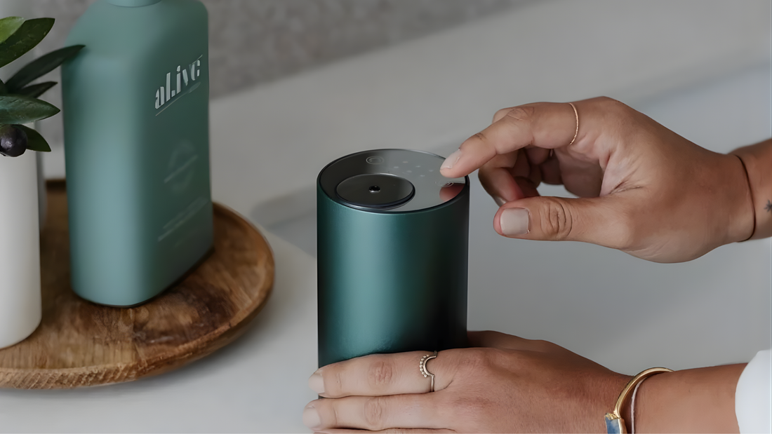 Close-up of waterless essential oil diffuser being operated in a home setting